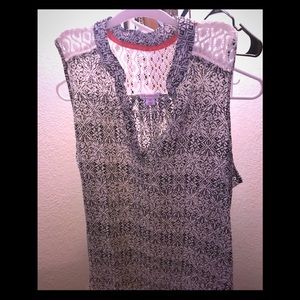 Sleeveless white and black top.